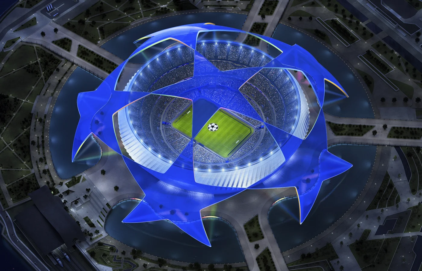 Luftaufnahme eines beleuchteten Stadions bei Nacht mit sternförmigem, blauem Dach